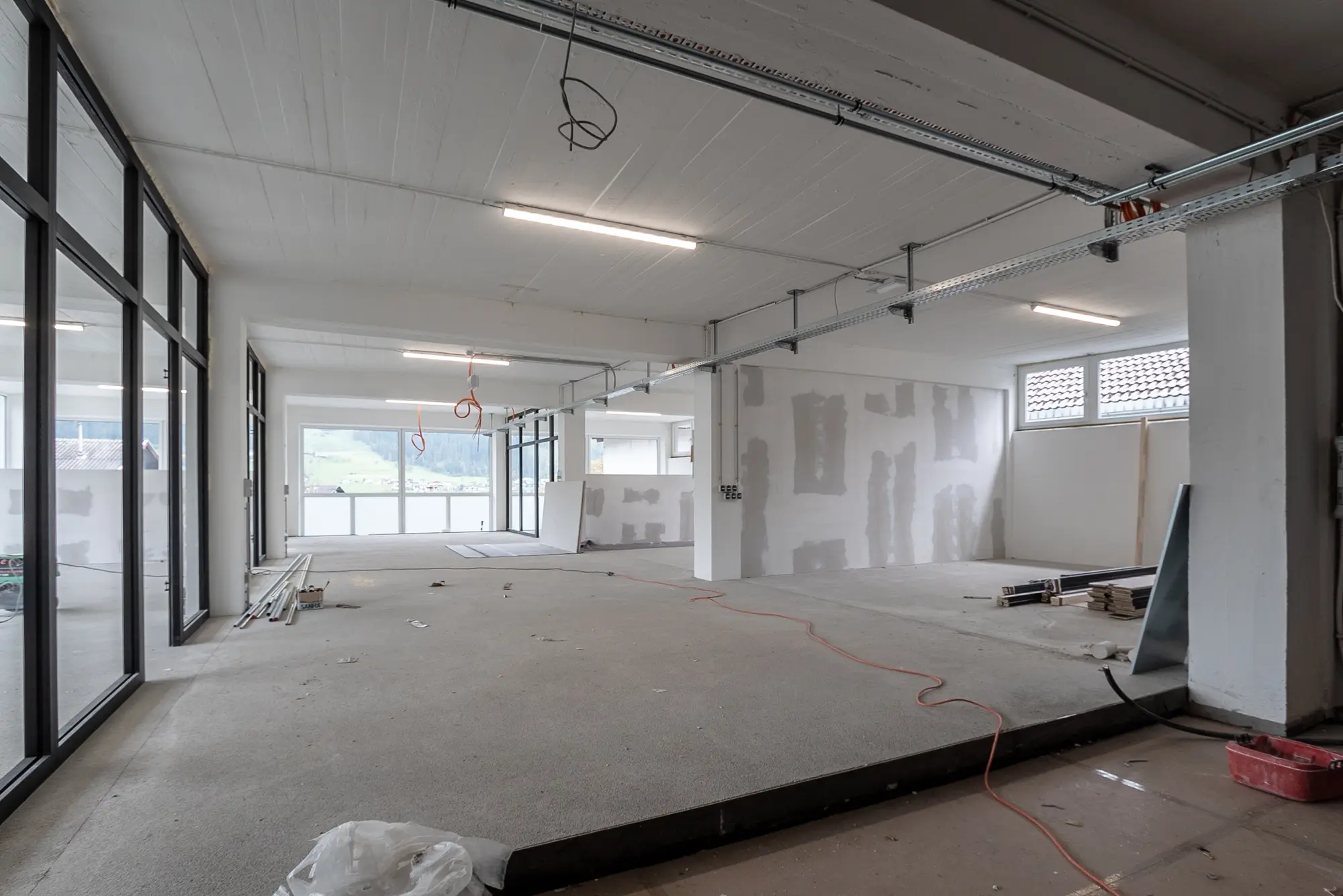 Newly built open-plan commercial interior awaiting final cleaning