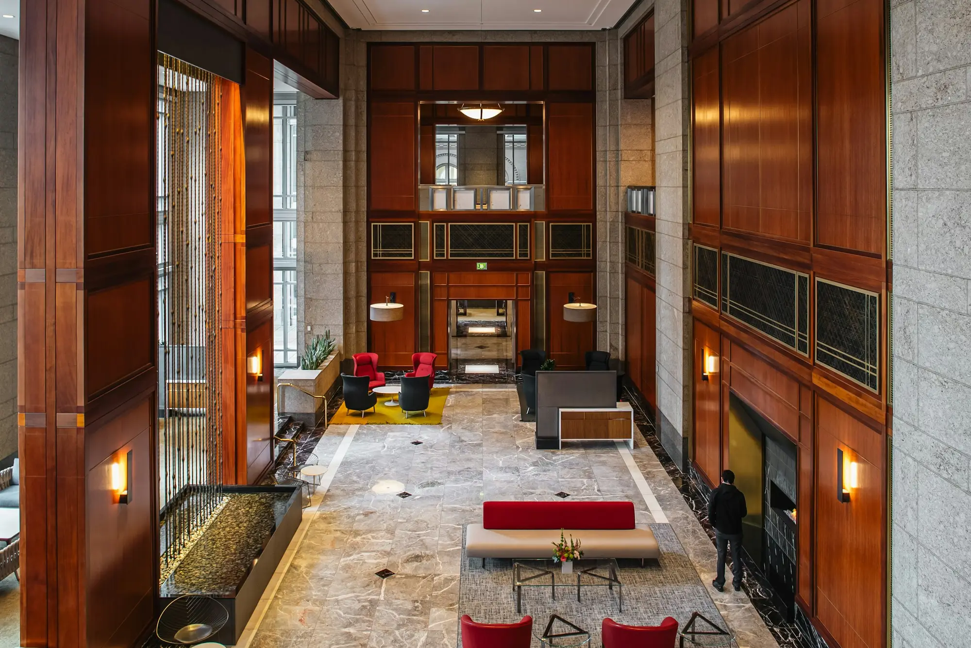 Immaculate hotel-style lobby with wood paneling and polished floors