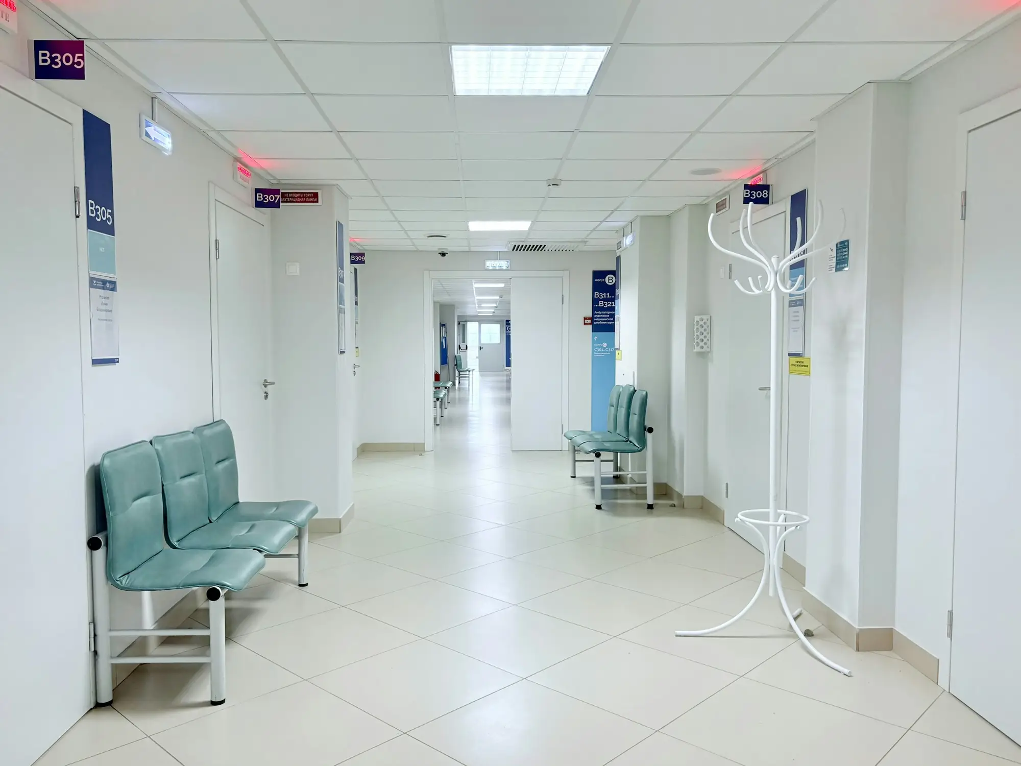 Clean hospital corridor with seating and polished floors